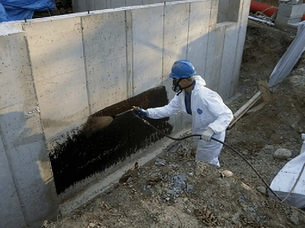 Professional waterproofing the exterior walls of the basement in Fort Worth, TX
