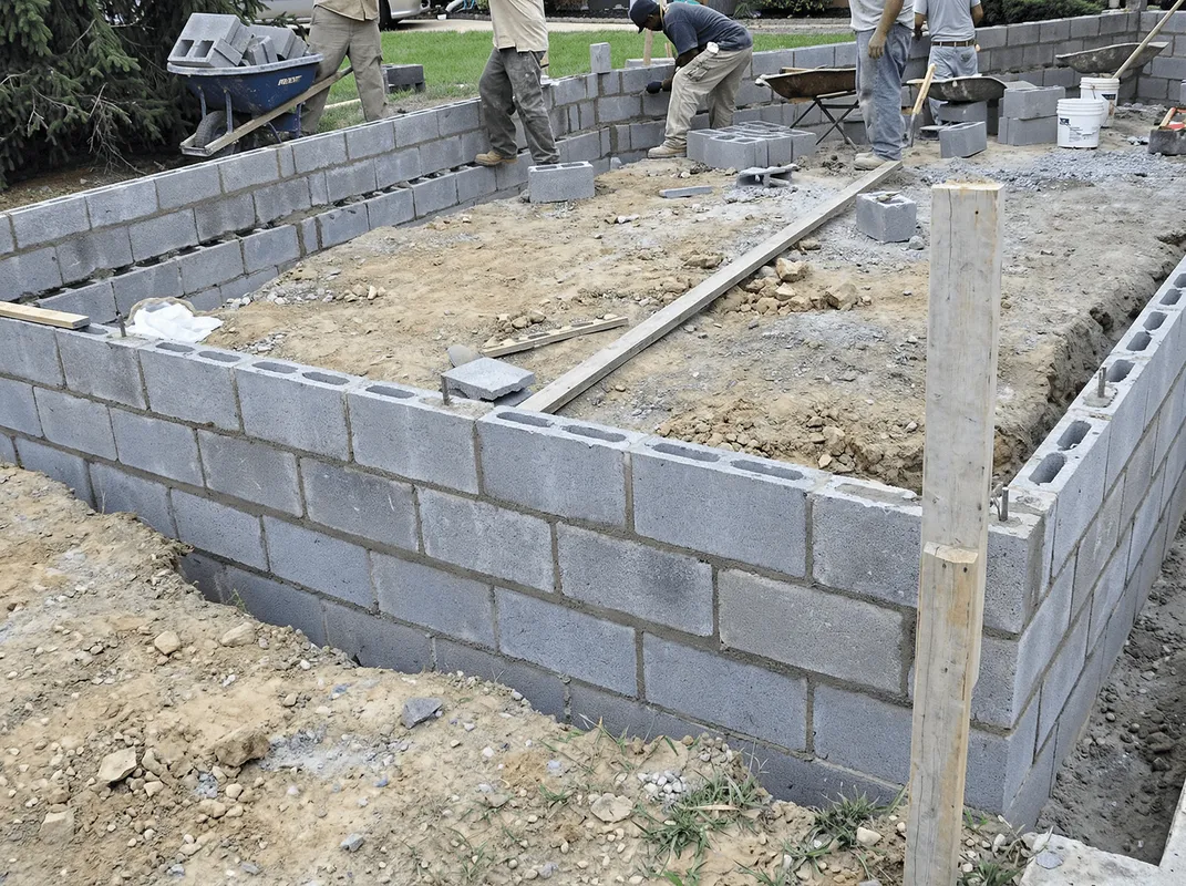 Professionals building a foundation with blocks in Fort Worth, TX