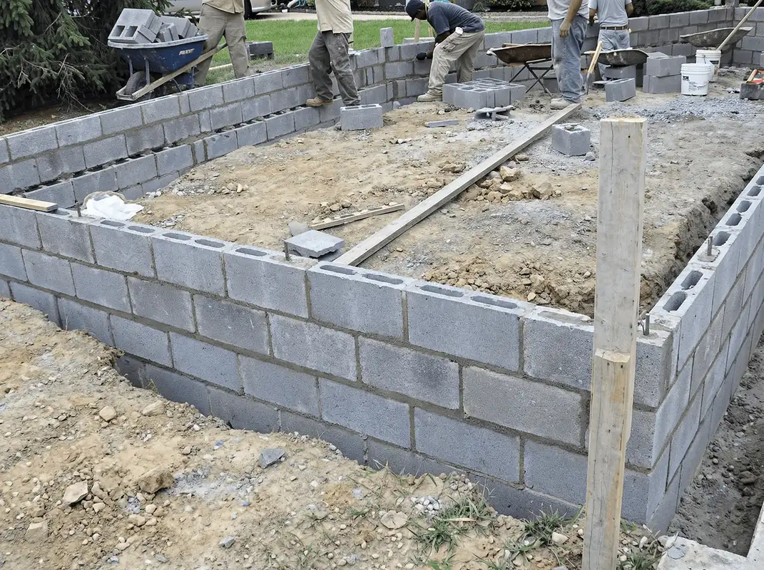 Professionals building a foundation with blocks in Fort Worth, TX