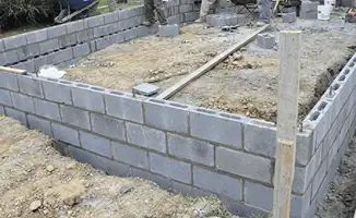 Professionals building a foundation with blocks in Fort Worth, TX