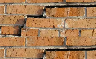 Brick wall with serious structural damage in Fort Worth, TX